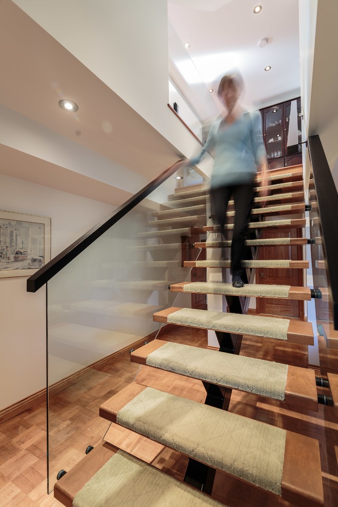 Staircase - mid-sized contemporary wooden floating open and glass railing staircase idea in Montreal
