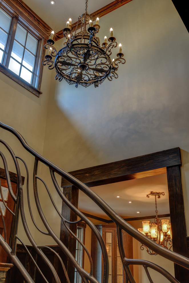 Inspiration for a large rustic wood u-shaped metal railing staircase in Other with wood risers.