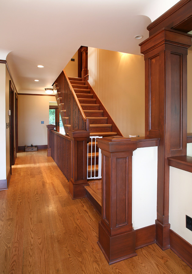 Medium sized classic wood straight staircase in Seattle with wood risers.
