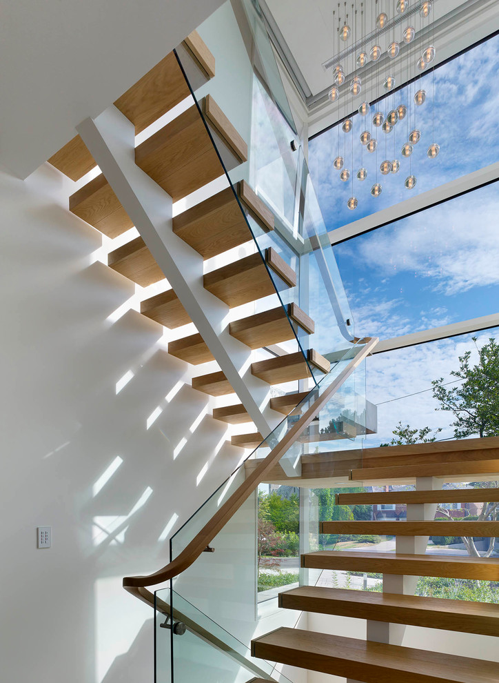 Large minimalist wooden floating open staircase photo in Toronto