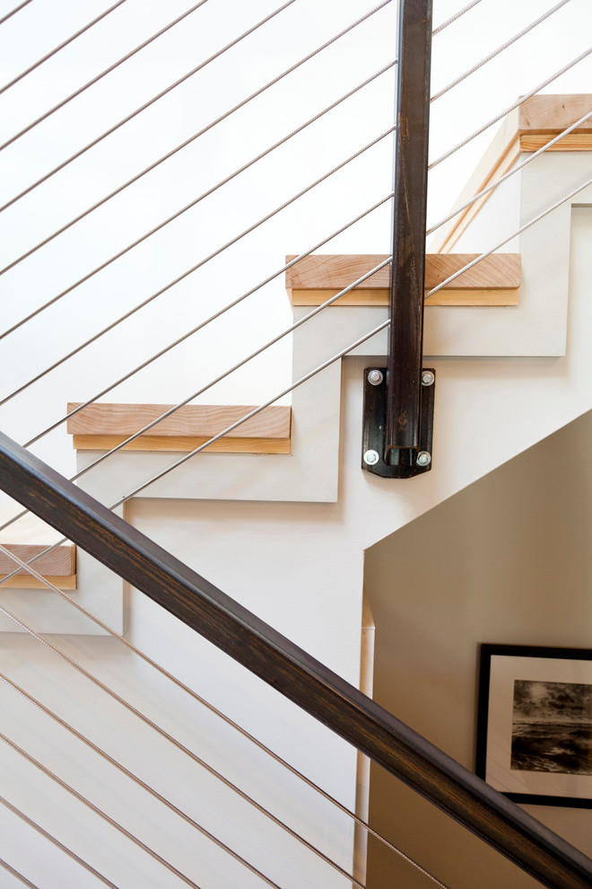 Staircase - mid-sized industrial wooden straight staircase idea in Boston with painted risers