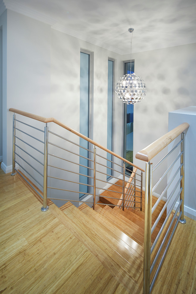Example of a trendy wooden u-shaped staircase design in Perth