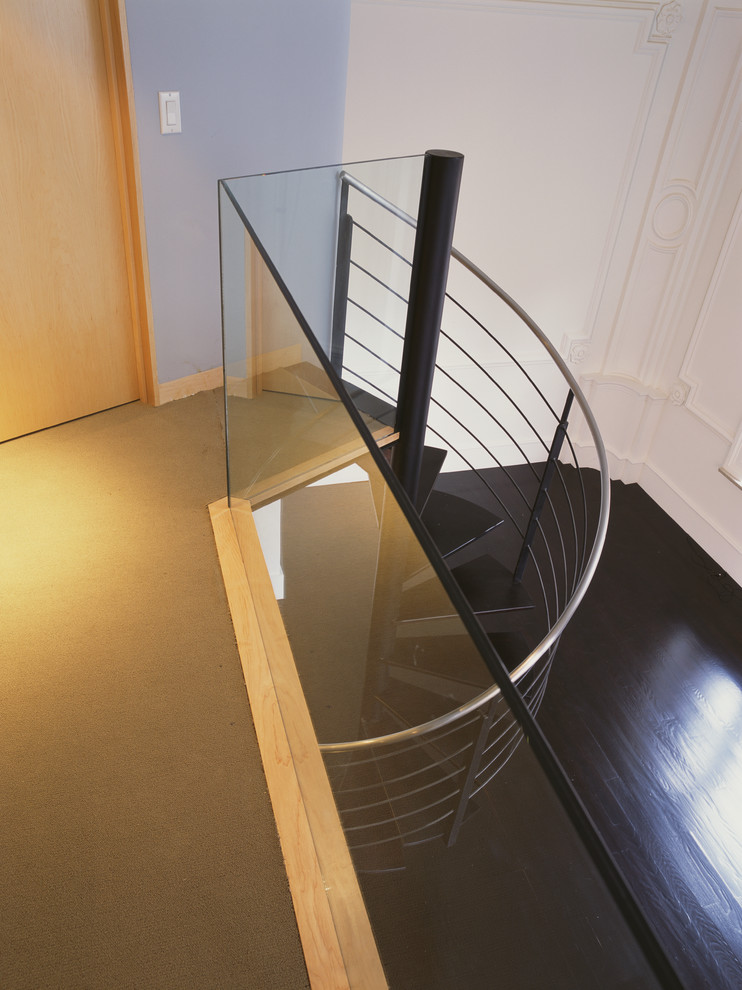 Design ideas for a medium sized contemporary metal spiral staircase in New York with open risers.