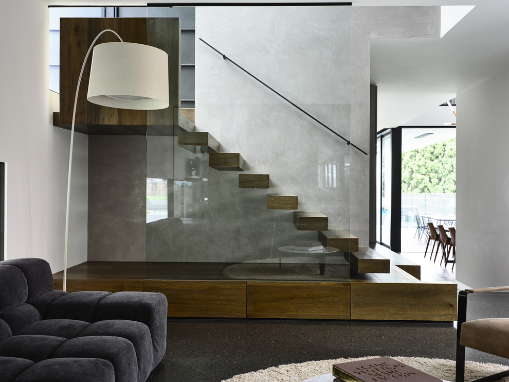 Imagen de escalera suspendida minimalista sin contrahuella con escalones de madera
