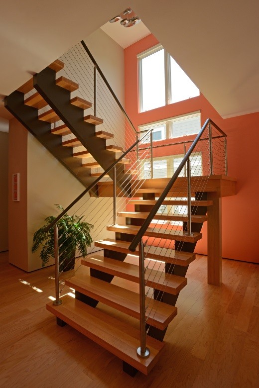 Inspiration for a medium sized coastal wood l-shaped staircase in Other with open risers.