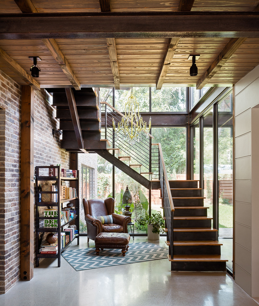 Staircase - rustic wooden staircase idea in Austin with metal risers