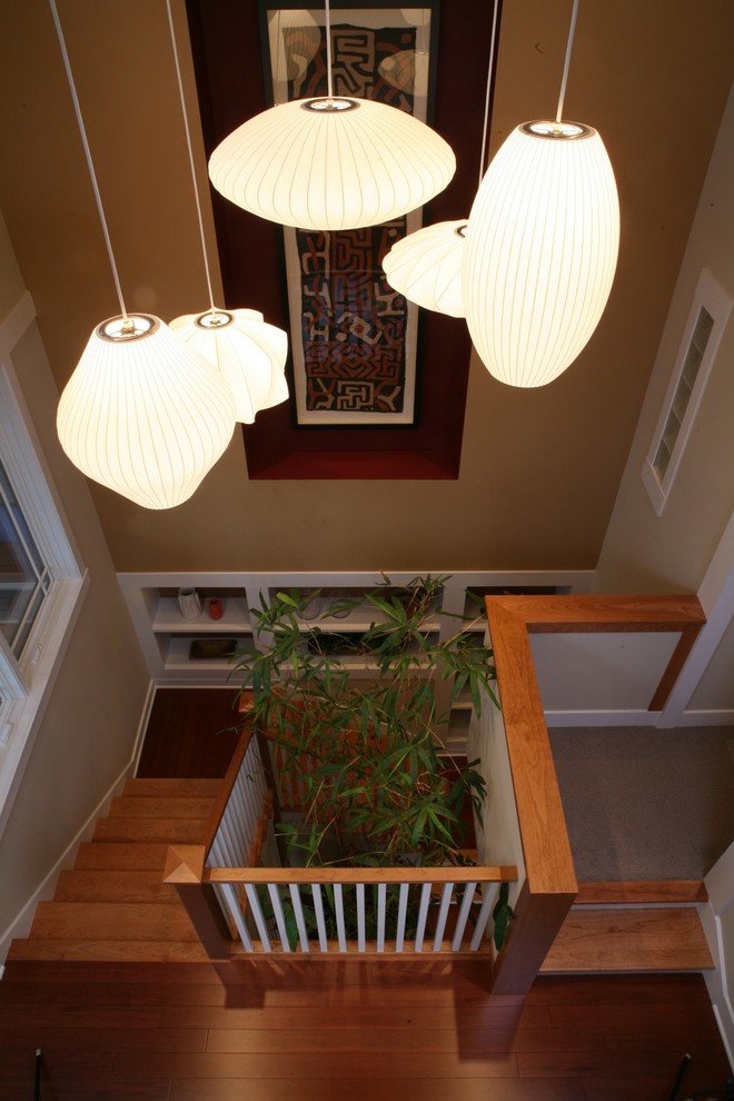 Photo of a classic wood staircase in Chicago with feature lighting.
