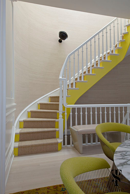 Staircase - huge modern wooden curved staircase idea in Chicago with painted risers