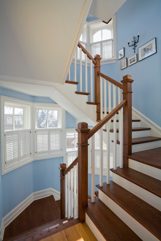 Staircase - mid-sized craftsman wooden curved staircase idea in Boston with painted risers