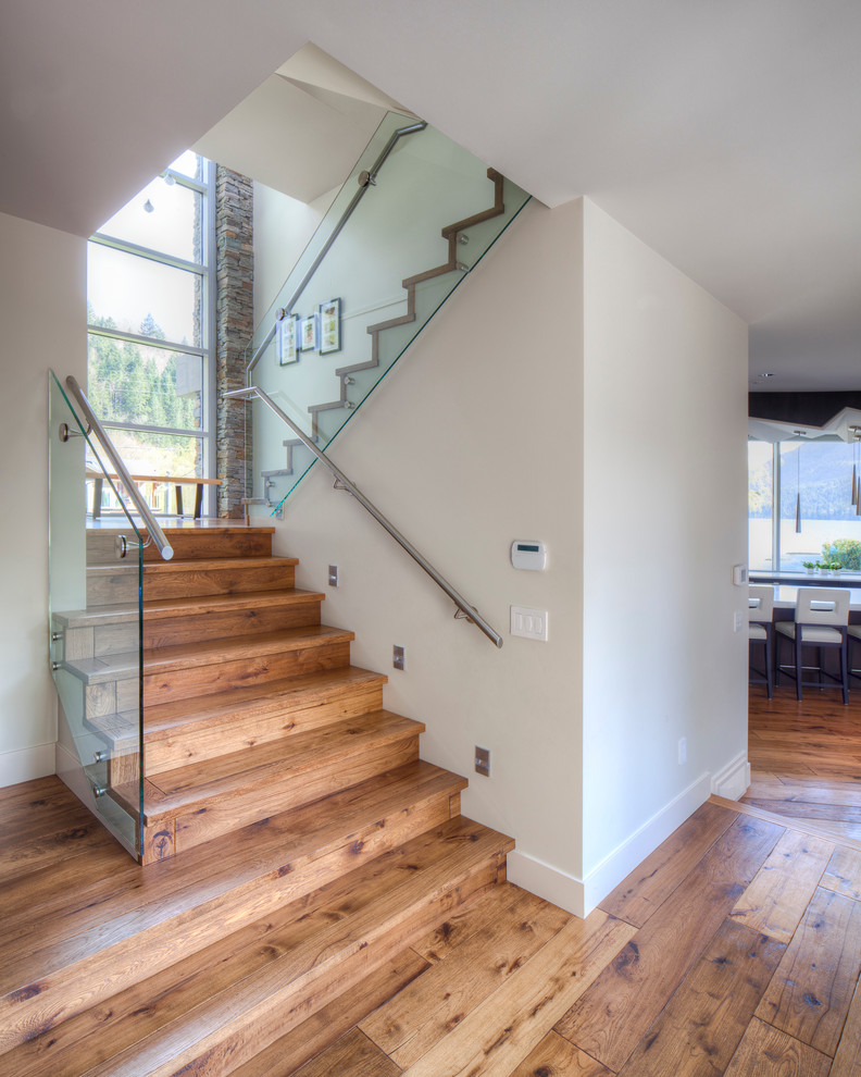 Photo of a contemporary wood l-shaped staircase in Vancouver with wood risers.