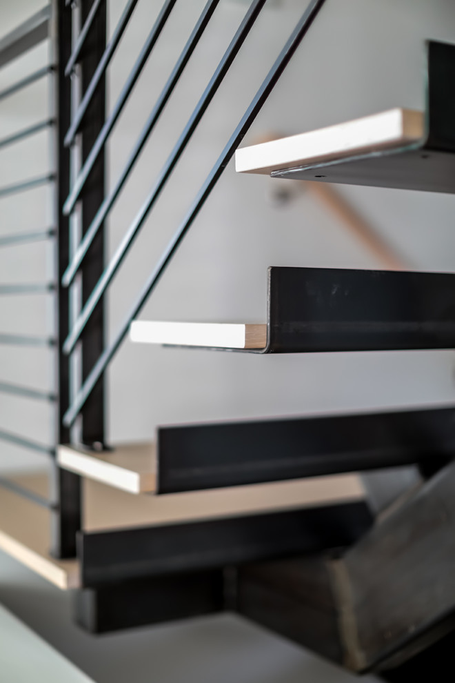Idéer för en modern l-trappa i trä, med öppna sättsteg