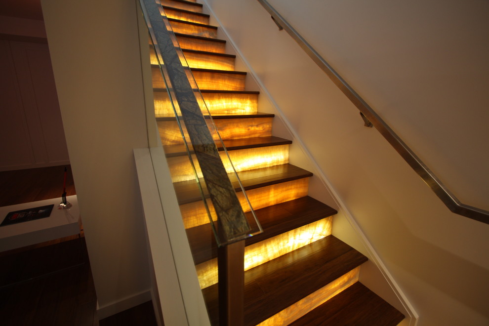 Inspiration for a contemporary wooden straight staircase remodel in Cleveland