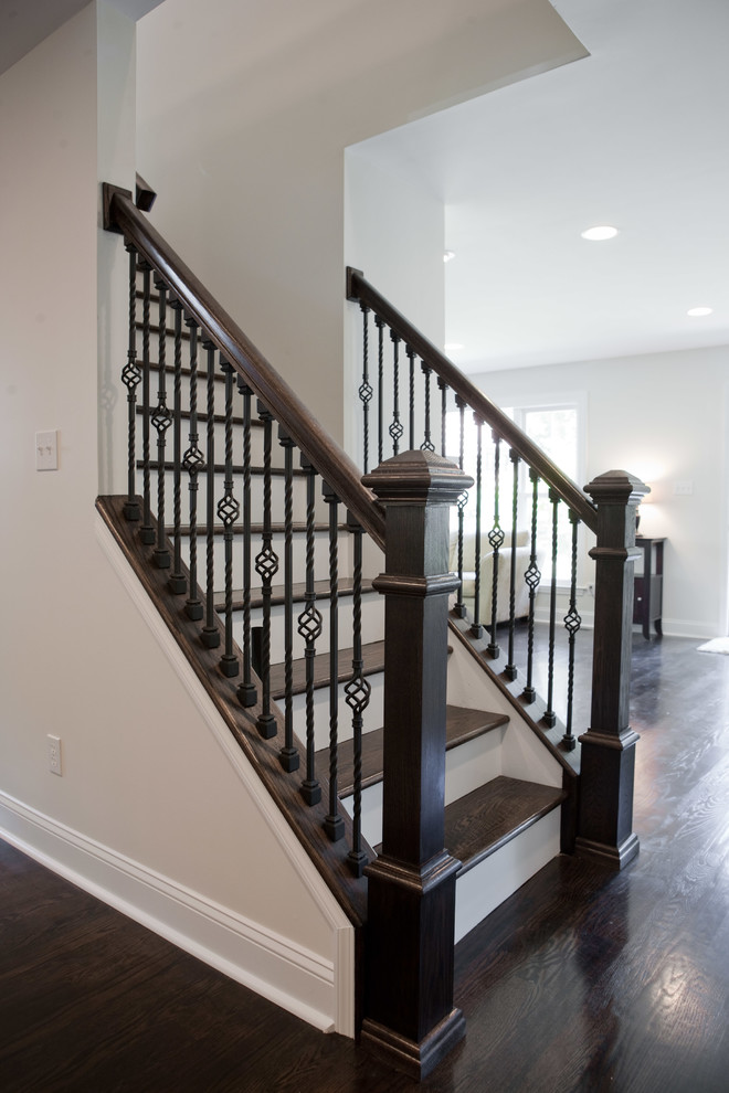 Inspiration for a mid-sized contemporary wooden straight metal railing staircase remodel in St Louis with painted risers