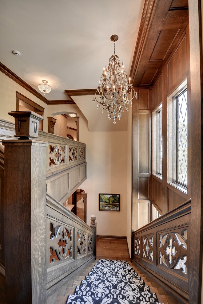 This is an example of a traditional staircase in Minneapolis with feature lighting.