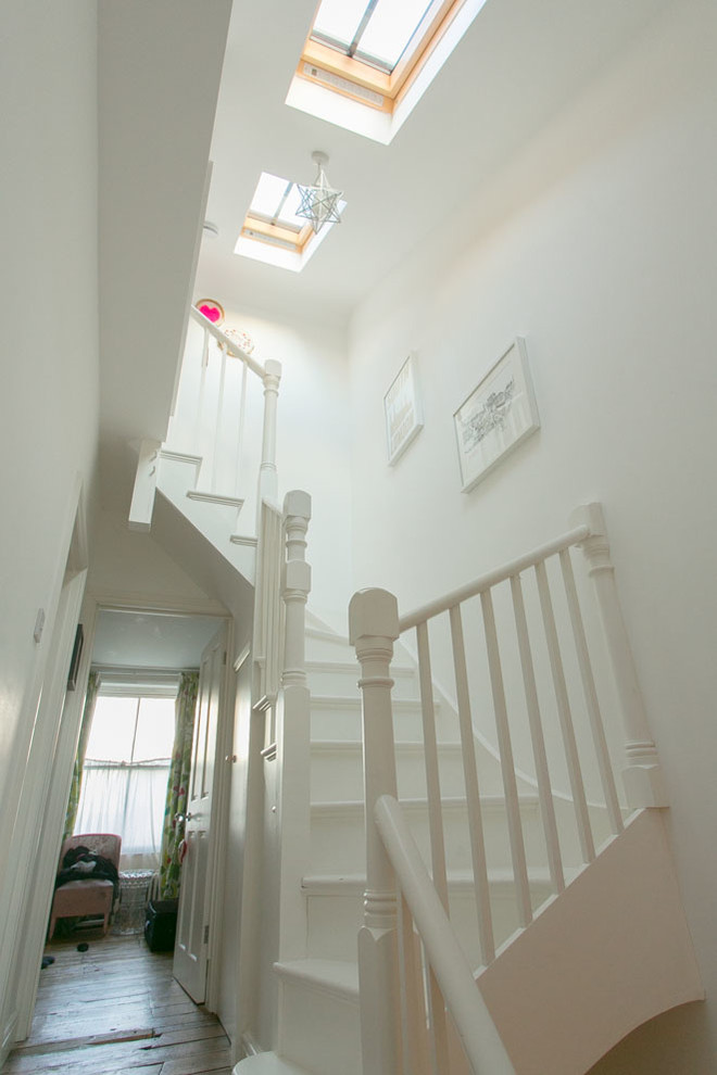 Idée de décoration pour un escalier bohème de taille moyenne.