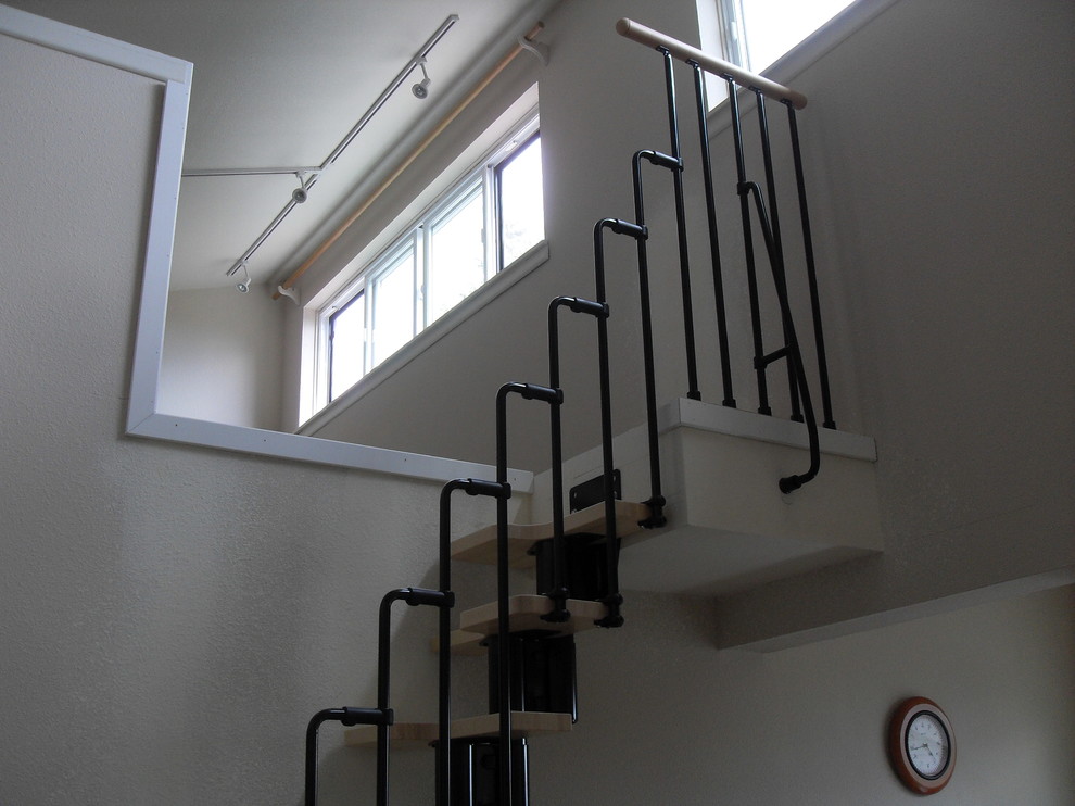 Design ideas for a contemporary staircase in Portland with feature lighting.