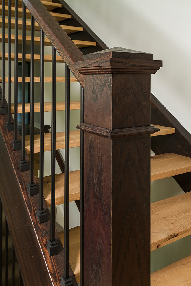 Modelo de escalera sin contrahuella con escalones de madera y barandilla de madera