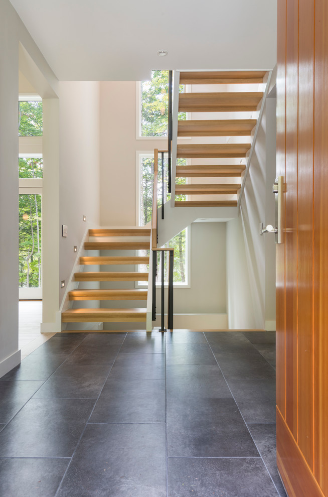Design ideas for a small contemporary wood u-shaped staircase in Boston with open risers.