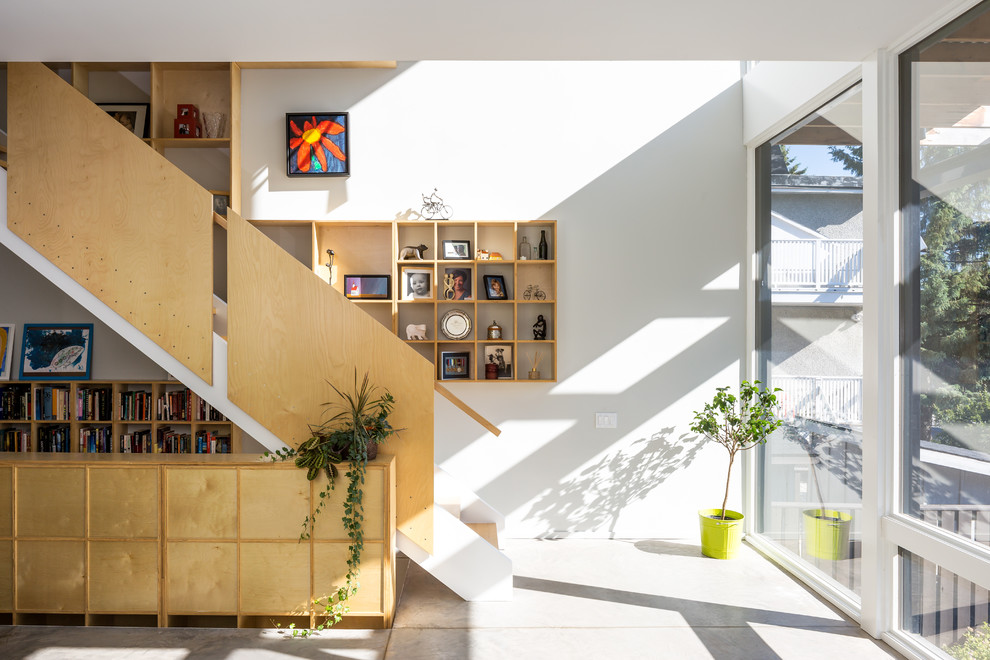 Inspiration for a large contemporary wooden straight staircase remodel in Ottawa with wooden risers