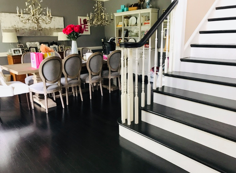 Large transitional painted straight wood railing staircase photo in Philadelphia with painted risers