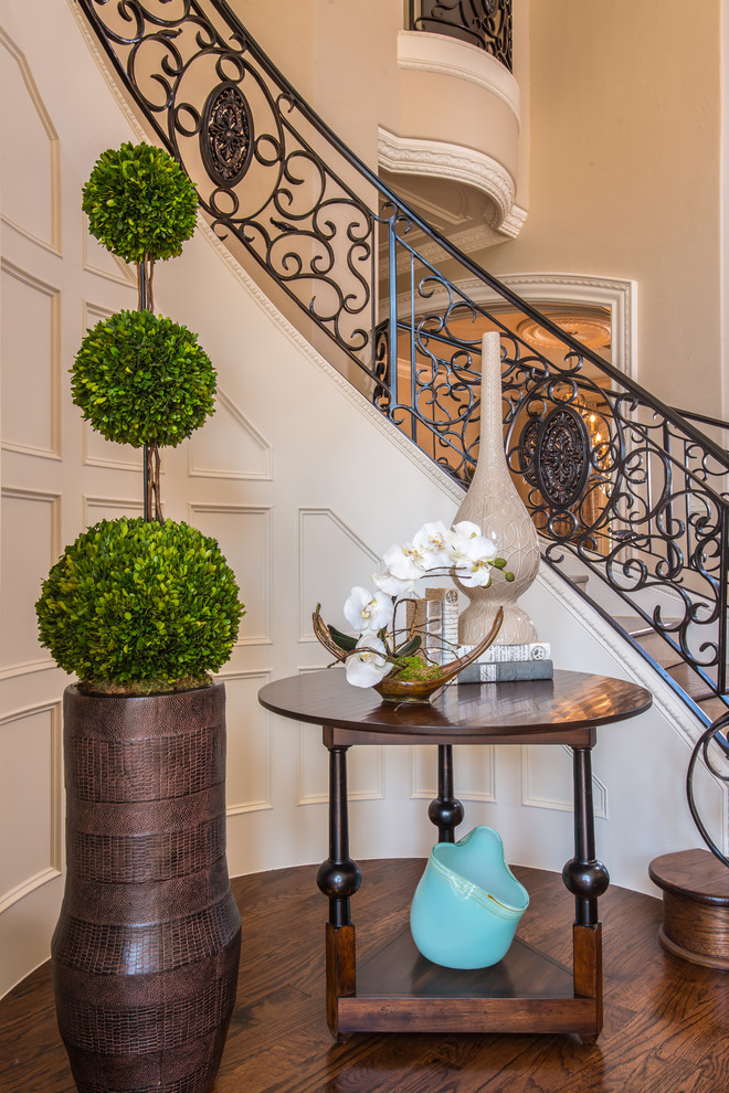 Inspiration for a large transitional wooden curved staircase remodel in Dallas with tile risers