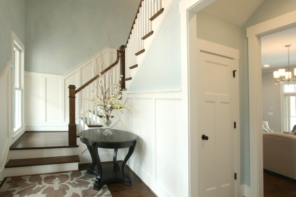Design ideas for a classic wood l-shaped staircase in Charlotte with wood risers.