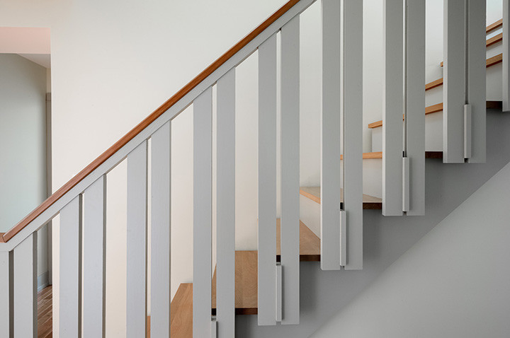 Design ideas for a contemporary wood wood railing staircase in Philadelphia with wood risers.