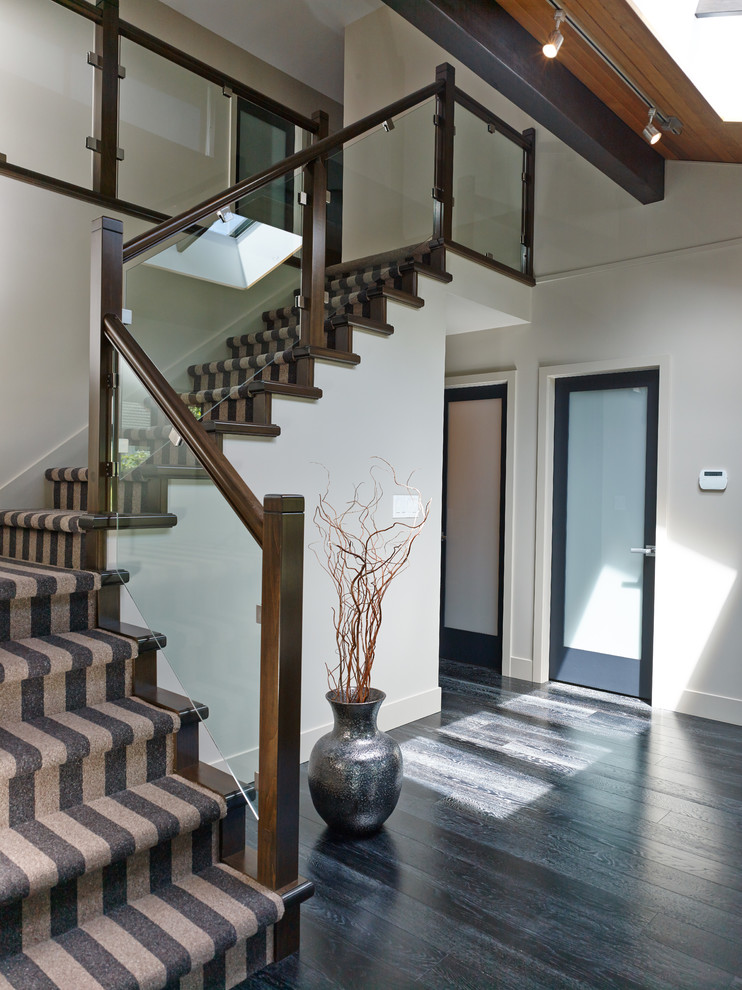 Staircase - mid-sized contemporary carpeted l-shaped staircase idea in Vancouver with carpeted risers