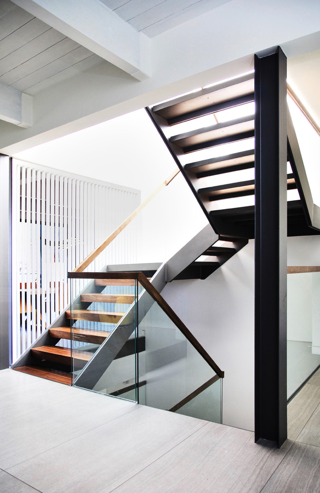 Example of a mid-sized minimalist wooden floating open staircase design in San Francisco