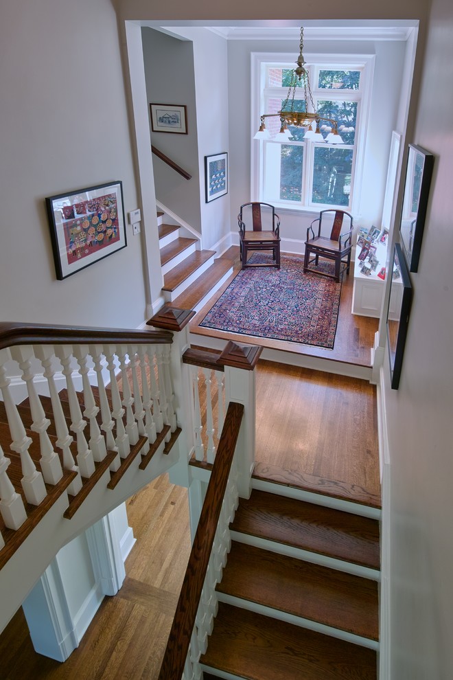 Staircase - large traditional wooden u-shaped wood railing staircase idea in Toronto with painted risers
