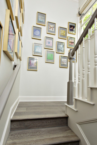 Photo of a large contemporary wood l-shaped staircase in Dallas with wood risers.