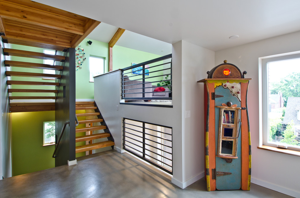 Design ideas for an eclectic u-shaped staircase in Seattle with open risers.