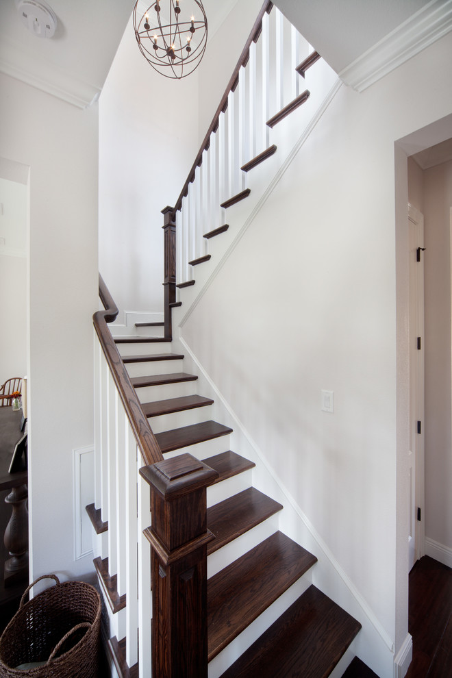 Mid-sized transitional wooden l-shaped staircase photo in Orlando with painted risers