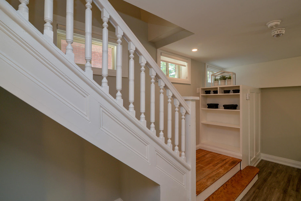 Inspiration for a mid-sized timeless wooden l-shaped wood railing staircase remodel in Other with painted risers