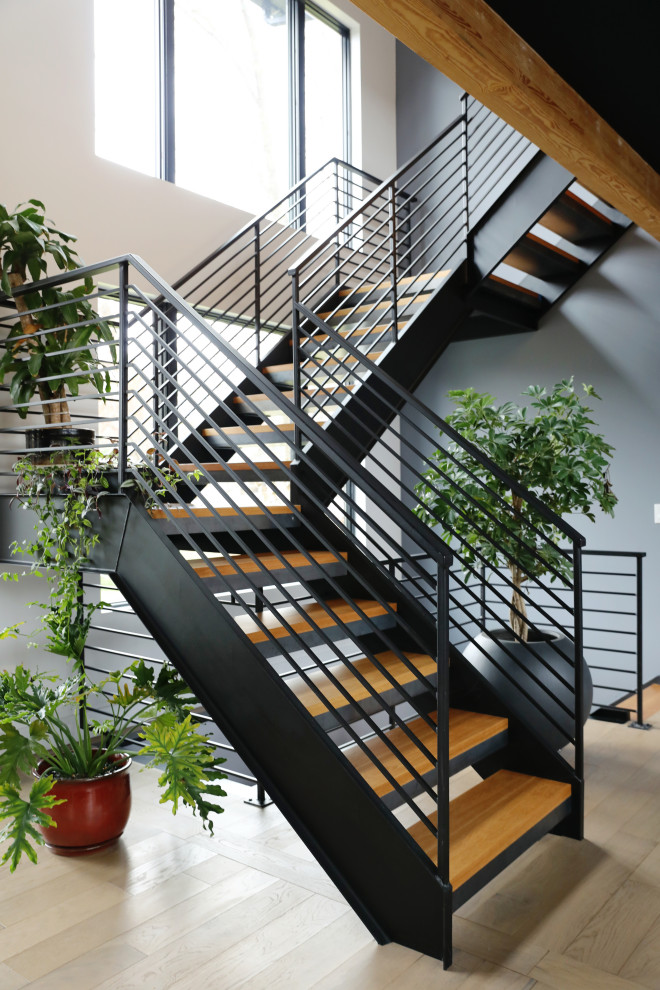 Staircase - mid-sized contemporary wooden floating metal railing staircase idea in New York
