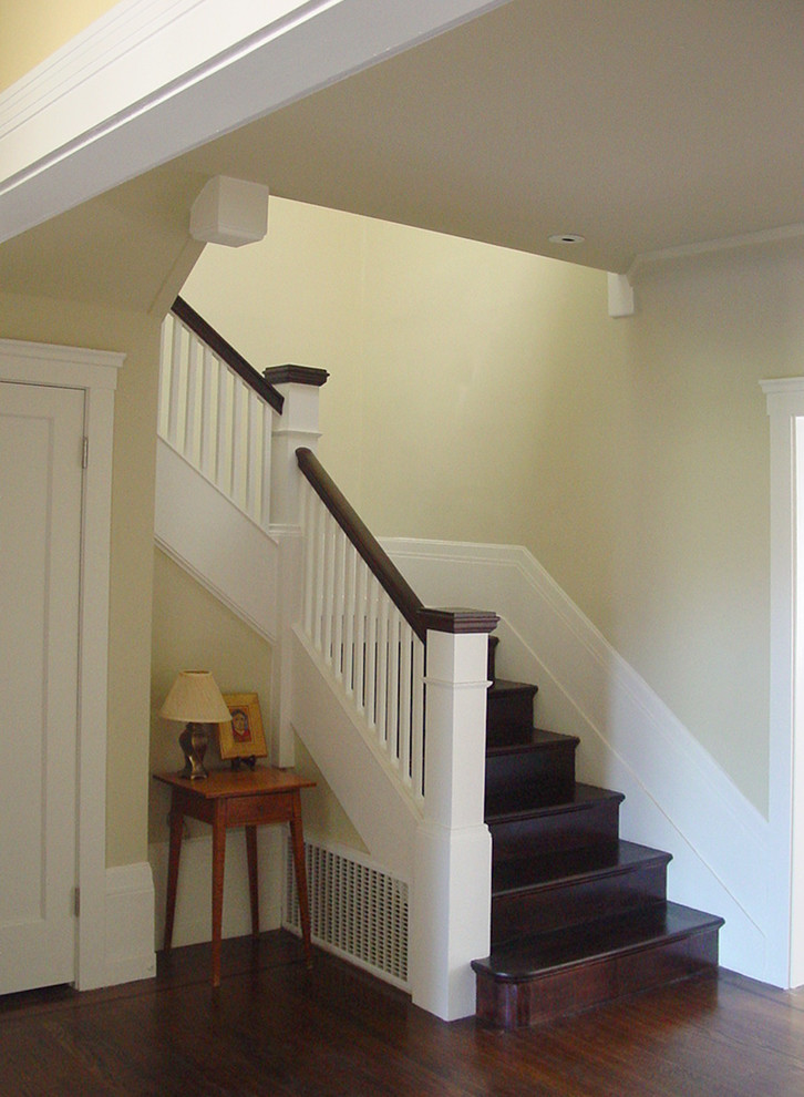 Mid-sized elegant wooden u-shaped wood railing staircase photo in San Francisco with wooden risers