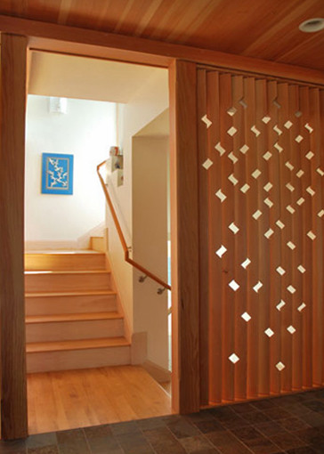Inspiration pour un escalier design en U de taille moyenne avec des marches en bois et des contremarches en bois.