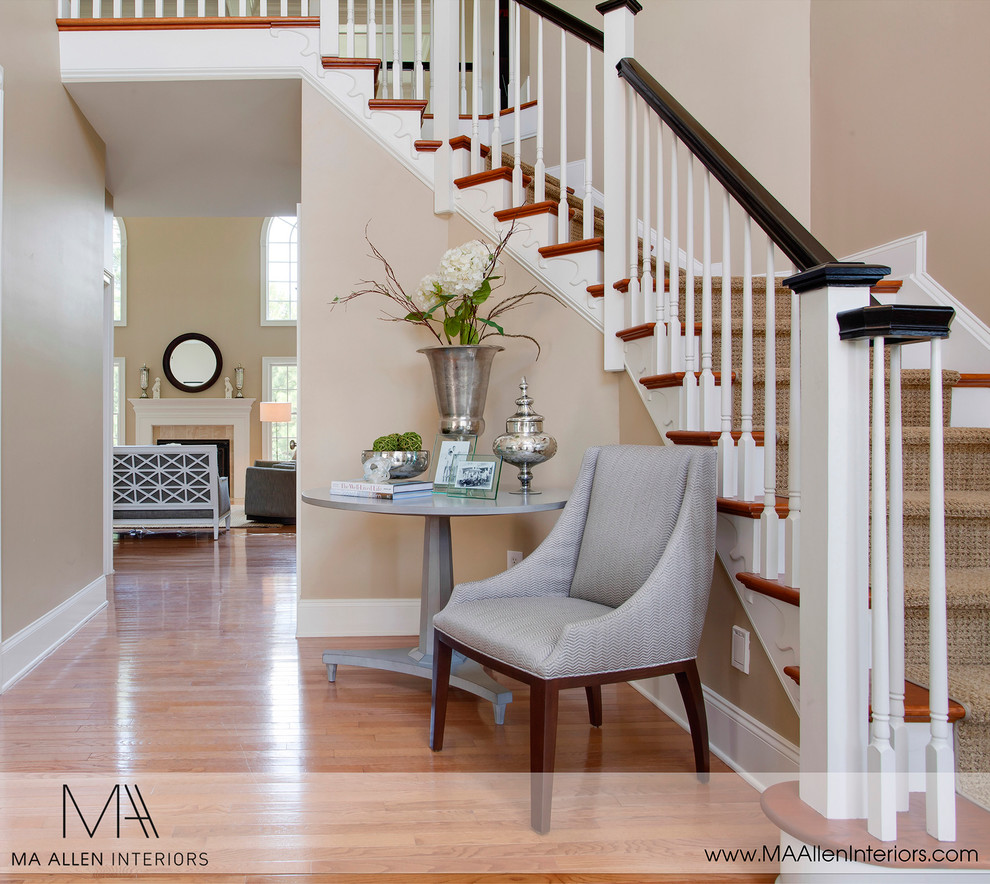 Classic staircase in Raleigh with feature lighting.