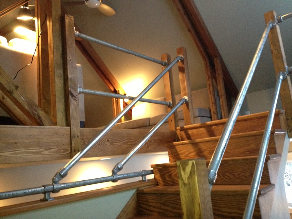 Small urban wooden u-shaped staircase photo in Other with wooden risers