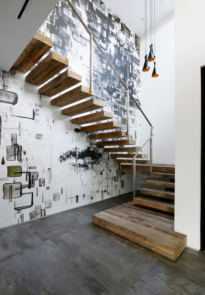 Idée de décoration pour un escalier sans contremarche design en U de taille moyenne avec des marches en bois.
