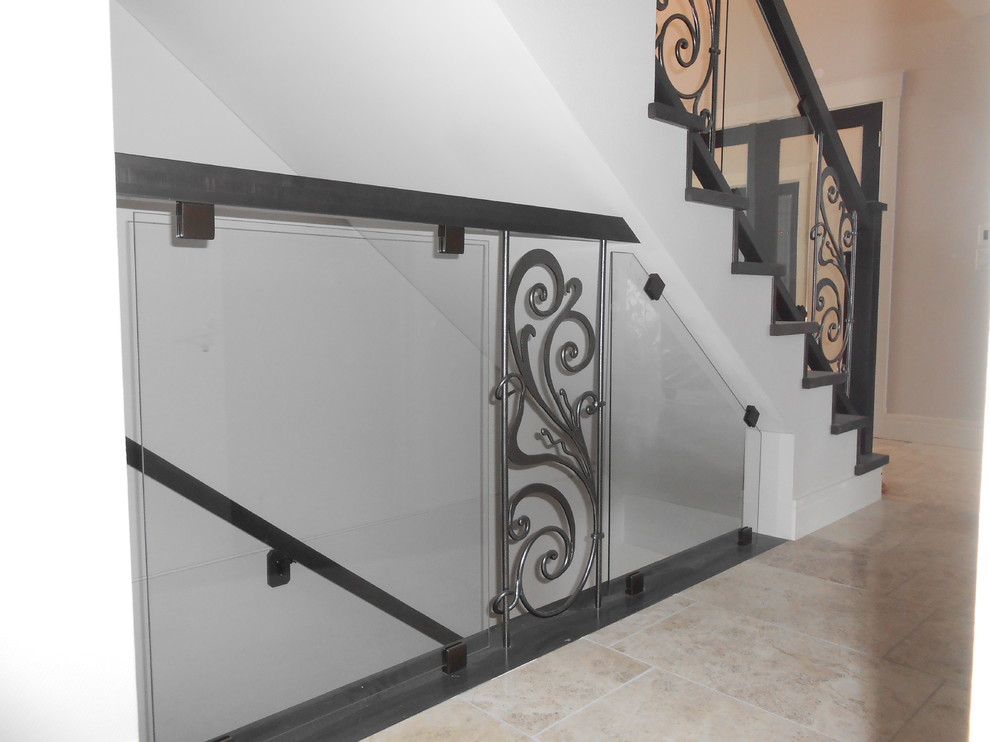Inspiration for a medium sized traditional carpeted straight metal railing staircase in Other with carpeted risers.