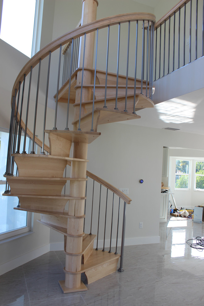 Small transitional wooden spiral mixed material railing staircase photo in Other with wooden risers