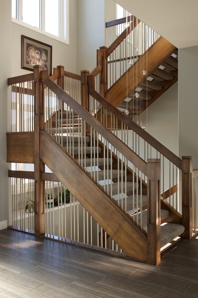 Inspiration for a contemporary carpeted l-shaped mixed railing staircase in Edmonton with open risers.