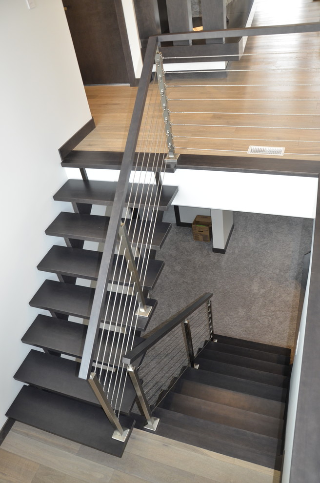 Example of a mid-sized trendy wooden u-shaped open staircase design in Other