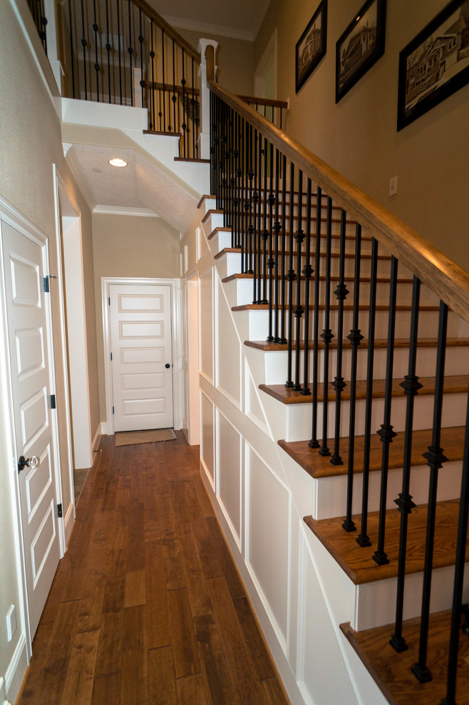 Photo of a medium sized traditional wood l-shaped staircase in Portland with wood risers.