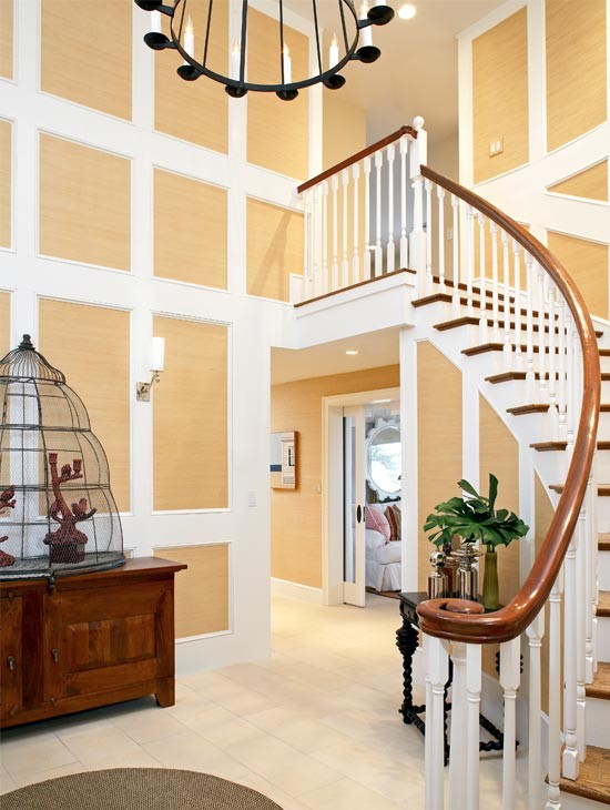 Design ideas for a large nautical wood curved staircase in Boston with painted wood risers.