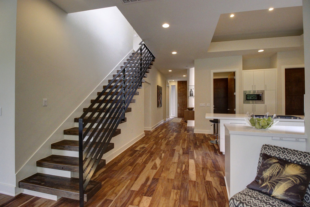 Example of a large trendy wooden straight open staircase design in Austin