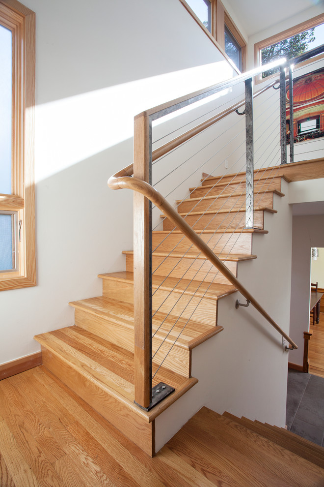 Example of a mid-sized trendy wooden u-shaped staircase design in San Francisco with wooden risers