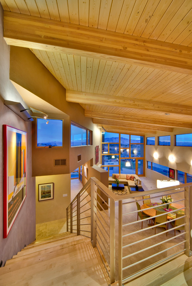 This is an example of an expansive modern wood floating staircase in Albuquerque.