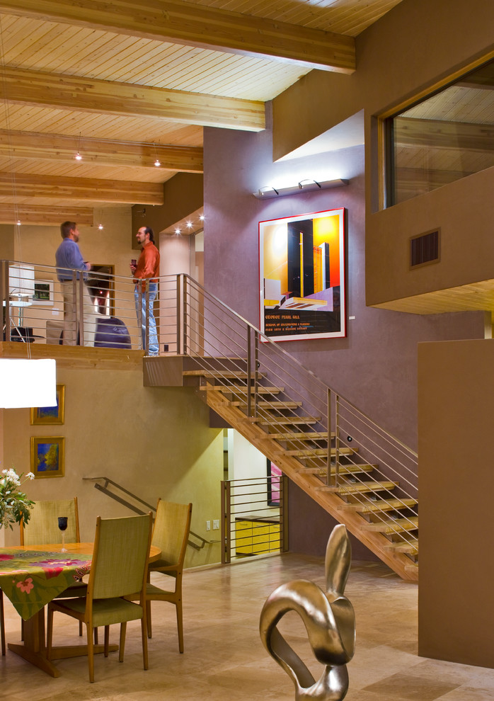 Huge minimalist wooden floating staircase photo in Albuquerque with metal risers